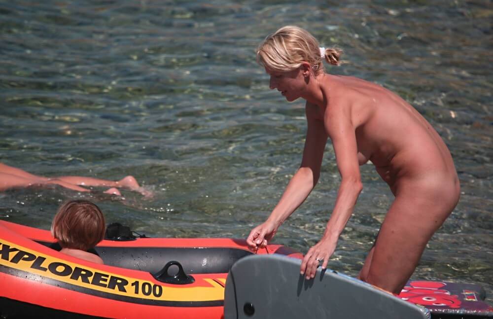 Red Boating for Two Nudists pics - The practice of naturism promotes inner harmony and peace