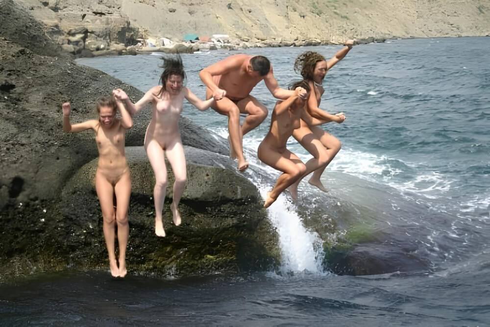 Mens and girls nudists on a beach - Naturism encourages sincerity and honesty regarding the body
