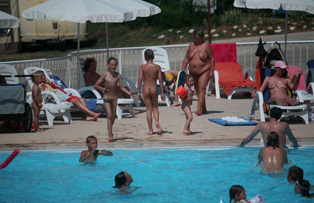 Naturist Afternoon Pool Games pics - Unlimited freedom is the guiding principle of nudism and naturism