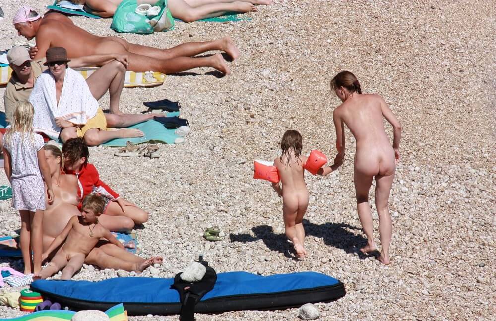 Orange Floaty Safety First Naturist pics - Respect for differences is valued in the nudist movement
